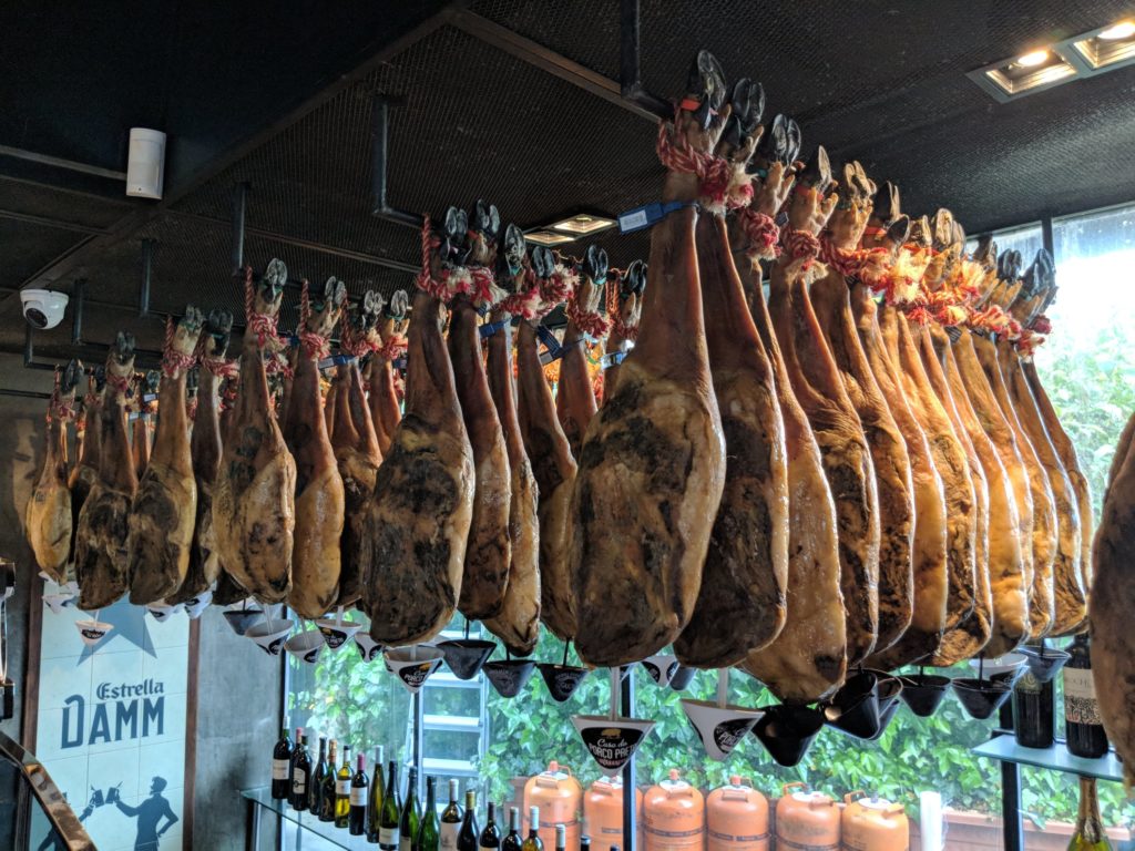 Iberico ham hanging in Lujo Iberico